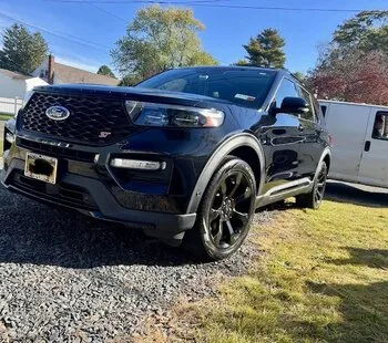 Black Ford Explorer ST parked on gravel after detailing