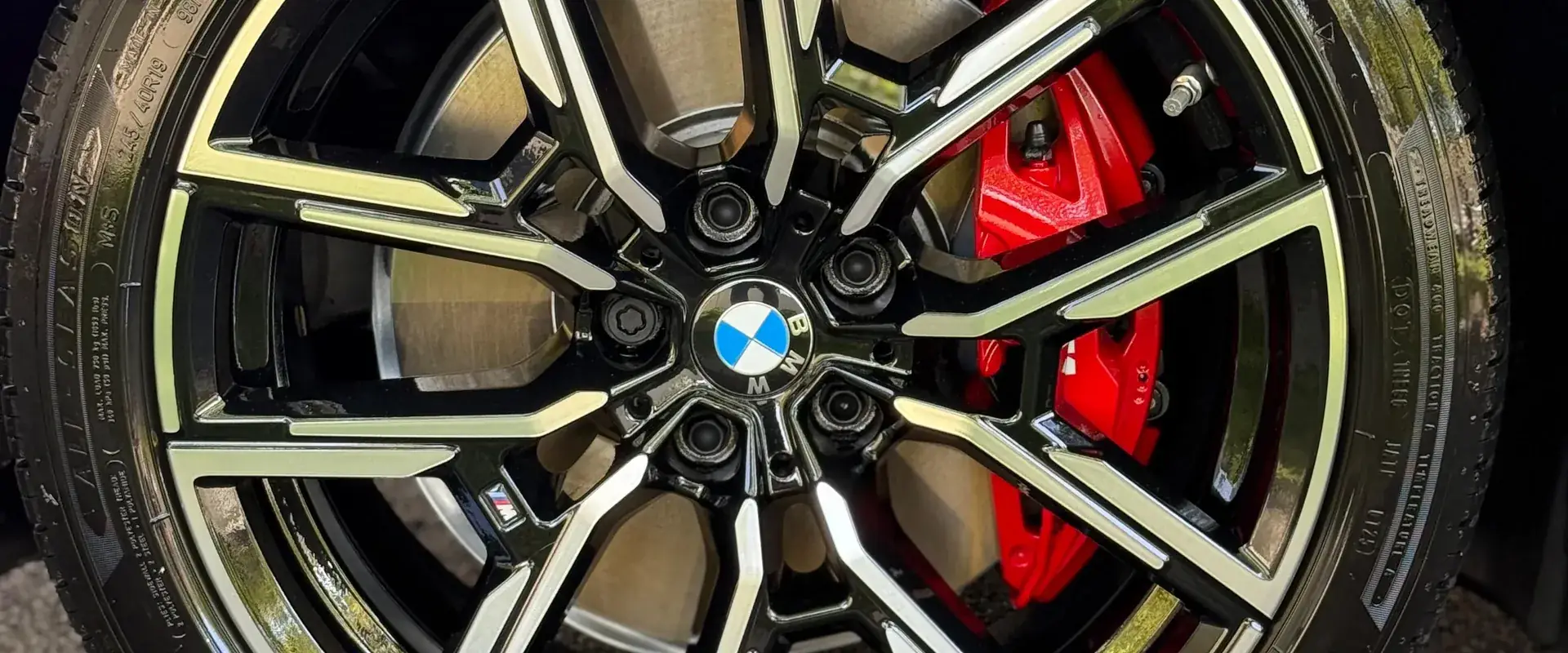 Ceramic coated BMW wheel with red brake caliper